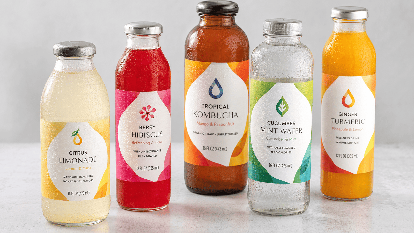 Waterproof adhesive labels for beverage bottles
